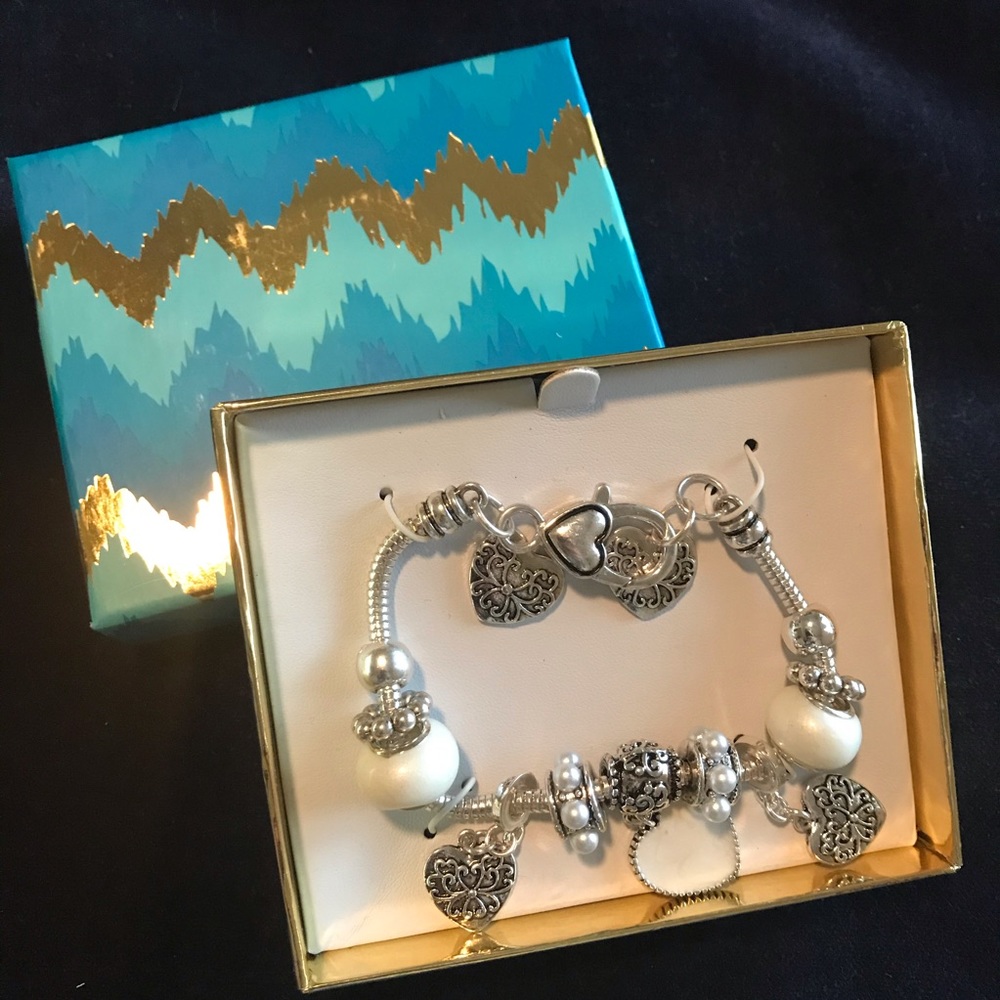 Silver charm bracelet with ivory hearts